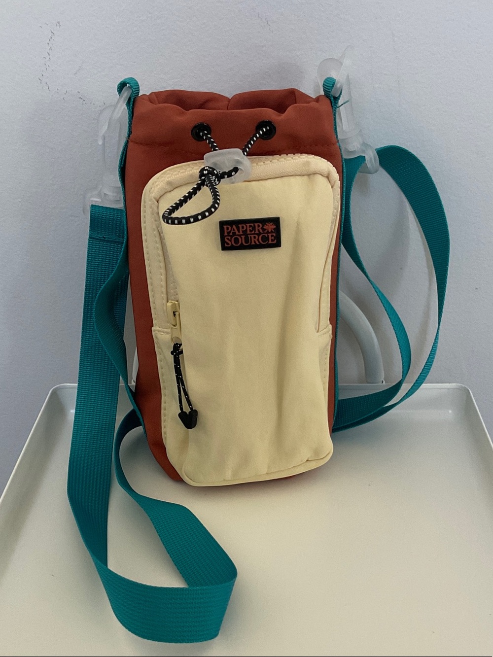 Paper Source Two-Tone Rust and Cream Water Bottle Crossbody with Teal Strap